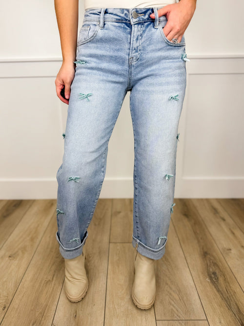Risen Cassidy High-Rise Barrel Leg Bow Detail Light Wash Cropped Blue Jeans